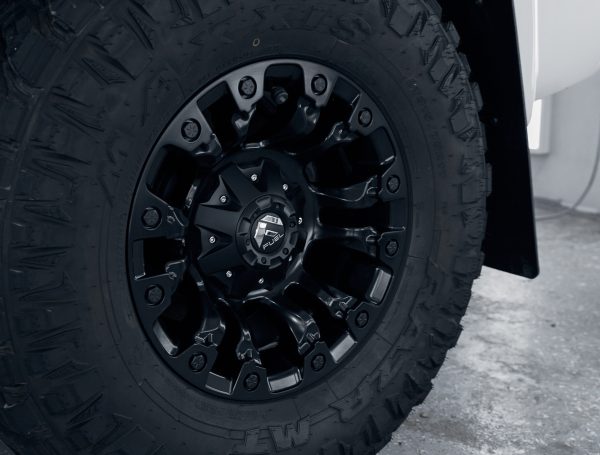 Close-up of a clean off-road wheel, showcasing its detailed, spotless surface and rugged design