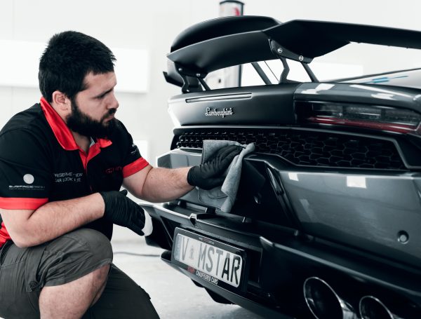 Lamborghini Aventador being wiped down with a cloth after completing the detailing treatment, showing a clean and polished finish.