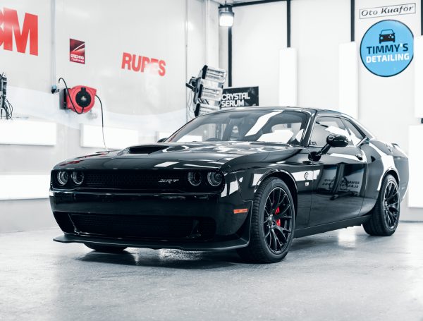 Finished Dodge Challenger in a studio, showcasing its flawless exterior and detailed finish.