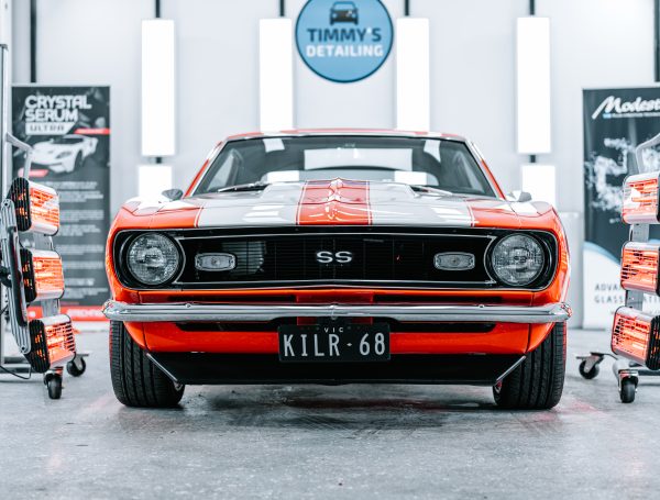 Camaro SS displayed in a studio, showcasing its sleek design and polished finish.