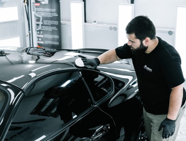 Toyota Supra being coated with a ceramic protection product, with the vehicle’s exterior being treated.