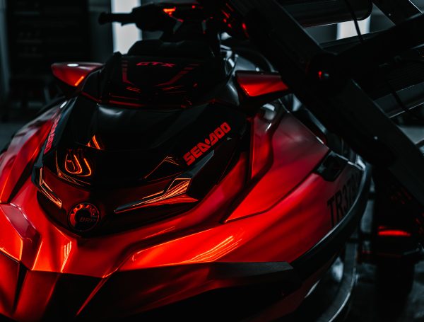 Jetski under infrared (IR) lights, with the surface curing after a coating treatment.