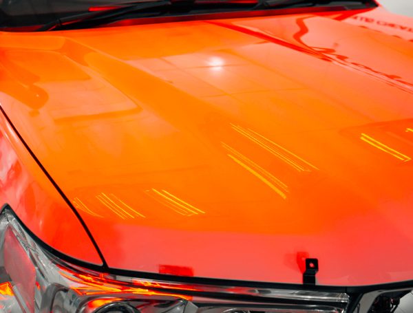 Bonnet with a flawless paint job, showcasing a smooth, glossy finish and no visible imperfections.