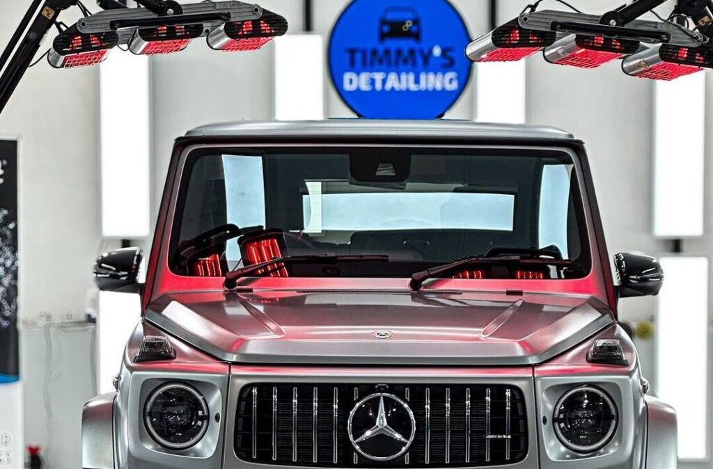 G-Wagon under infrared (IR) lights, with the ceramic coating curing on the vehicle’s surface.