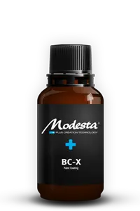 Bottle of Modesta ceramic coating with its label clearly visible.